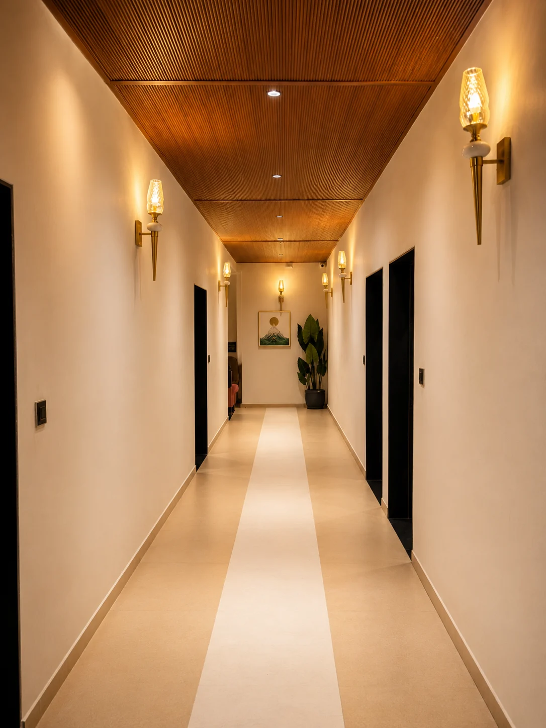 Corridor with brass lamps and a wooden ceiling
